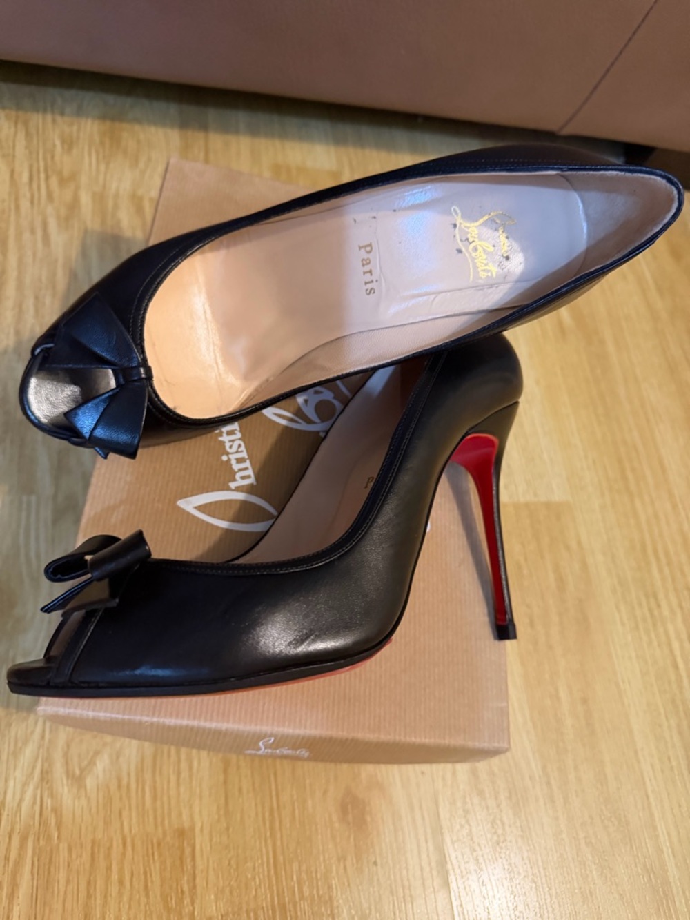 Christian Louboutin Black Leather Peep-Toe Pump with Bow and Red Heel